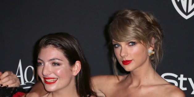 BEVERLY HILLS, CA - JANUARY 11: Recording artists Lorde (L) and Taylor Swift attend the 2015 InStyle and Warner Bros. 72nd A