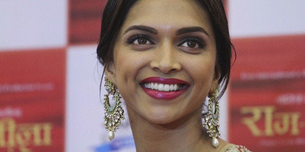 In this Wednesday, Oct. 9, 2013 photo, Indian Bollywood actress Deepika Padukone smiles during a press conference held to promote her new Hindi film Ramleela in Ahmadabad, India. The film will be released on Nov. 15. (AP Photo/Ajit Solanki)