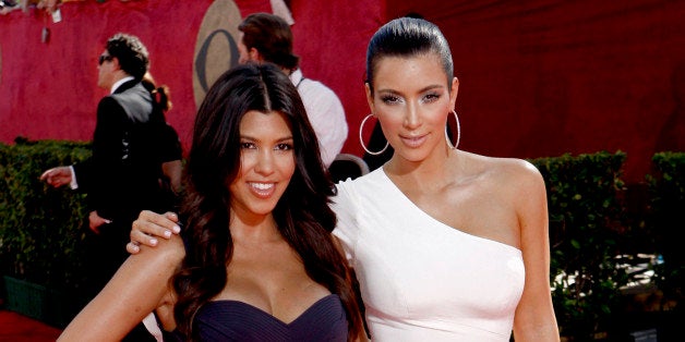 Kourtney Kardashian, left, and Kim Kardashian arrive at the 61st Primetime Emmy Awards on Sunday, Sept. 20, 2009, in Los Ange