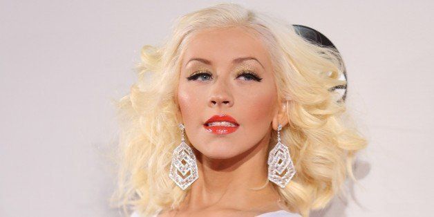 Christina Aguilera arrives at the 2013 American Music Awards, on Sunday, Nov. 24, 2013 in Los Angeles. (Photo by Matt Sayles/Invision/AP)