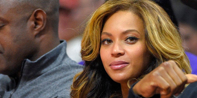 Singer Beyonce watches the first half of an NBA basketball game between the Los Angeles Clippers and the Brooklyn Nets, Thurs