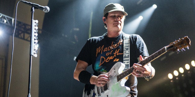 LONDON, UNITED KINGDOM - AUGUST 06: Thomas DeLonge of Blink 182 performs on stage during their Reading Leeds Festival warmup show at Brixton Academy on August 6, 2014 in London, United Kingdom. (Photo by Ollie Millington/Redferns via Getty Images)