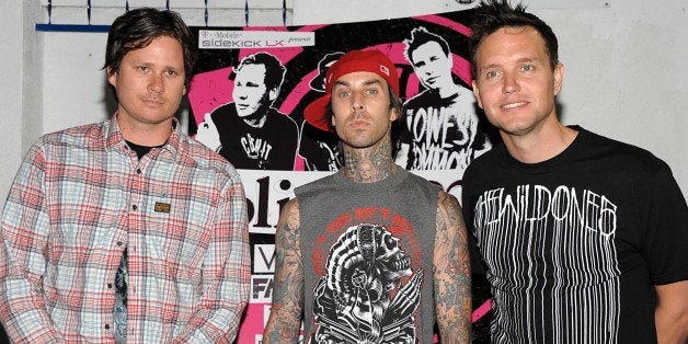 FILE - In this May 18, 2009 file photo, Tom DeLonge, left, drummer Travis Barker, and singer and musician Mark Hoppus, right, of the rock band Blink-182 arrive at the Blink-182 tour launch party in Los Angeles. (AP Photo/Dan Steinberg, file)