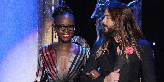 LOS ANGELES, CA - JANUARY 25: Actress Lupita Nyong'o and actor Jared Leto speak onstage at the 21st Annual Screen Actors Guild Awards at The Shrine Auditorium on January 25, 2015 in Los Angeles, California. (Photo by Kevork Djansezian/Getty Images)
