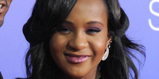 FILE - In this Aug. 16, 2012, file photo, Bobbi Kristina Brown attends the Los Angeles premiere of "Sparkle" at Grauman's Chinese Theatre in Los Angeles. Brown's father and aunt have been appointed co-guardians of the ailing 22-year-old daughter of the late Whitney Houston. Lawyers for Bobby Brown and Pat Houston issued a joint statement Friday, May 8, 2015. The statement says Brown and Houston will have joint responsibility for decisions related to "Krissi's care and medical needs."(Photo by Jordan Strauss/Invision/AP, File)