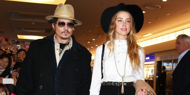 TOKYO, JAPAN - JANUARY 26: Johnny Depp and Amber Heard are seen upon arrival at Haneda Airport on January 26, 2015 in Tokyo, Japan. (Photo by Jun Sato/GC Images)