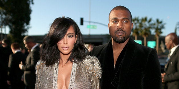 LOS ANGELES, CA - FEBRUARY 08: TV personality Kim Kardashian (L) and recording artist Kanye West attend The 57th Annual GRAM