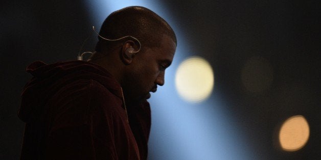 Kanye West performs on stage at the 57th Annual Grammy Awards in Los Angeles February 8, 2015. AFP PHOTO/ROBYN BECK (Photo credit should read ROBYN BECK/AFP/Getty Images)