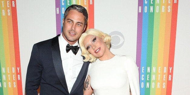 WASHINGTON, DC - DECEMBER 07: Taylor Kinney and Lady Gaga arrive at the 37th Annual Kennedy Center Honors at the John F. Kennedy Center for the Performing Arts on December 7, 2014 in Washington, DC. (Photo by Paul Morigi/WireImage)