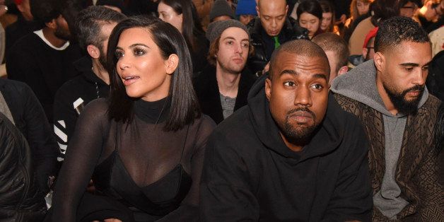 NEW YORK, NY - FEBRUARY 14: Kim Kardashian and Kanye West attend the Robert Geller show during Mercedes-Benz Fashion Week Fall 2015 at Pier 59 on February 14, 2015 in New York City. (Photo by Vivien Killilea/Getty Images)