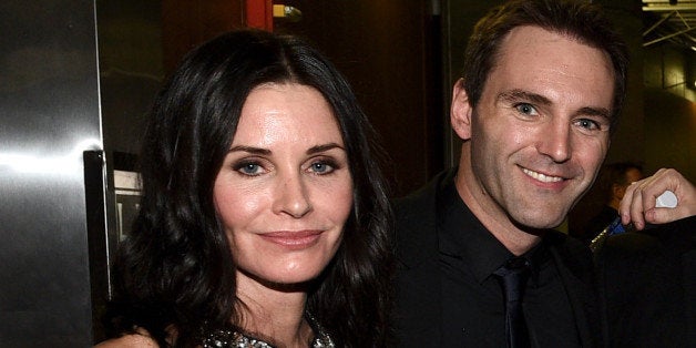 LOS ANGELES, CA - FEBRUARY 08: Actress Courteney Cox (L) and musician Johnny McDaid attend The 57th Annual GRAMMY Awards at S