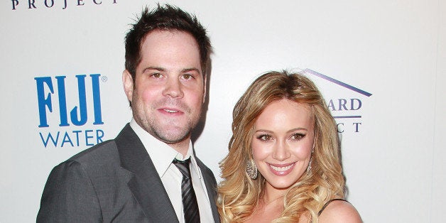 BEVERLY HILLS, CA - MAY 11: Professional hockey player Mike Comrie (L) and wife actress Hilary Duff attend An Evening of 'So