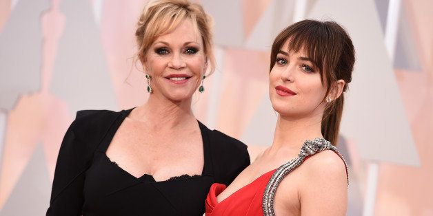Dakota Johnson, right, and Melanie Griffith arrive at the Oscars on Sunday, Feb. 22, 2015, at the Dolby Theatre in Los Angeles. (Photo by Jordan Strauss/Invision/AP)
