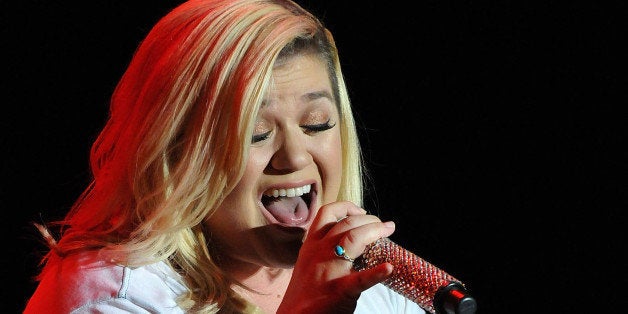 ORLANDO, FL - FEBRUARY 21: Kelly Clarkson performs during Mardi Gras celebration at Universal Orlando on February 21, 2015 i