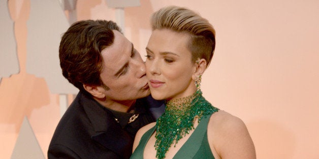 HOLLYWOOD, CA - FEBRUARY 22: Actor John Travolta (L) and actress Scarlett Johansson attend the 87th Annual Academy Awards at Hollywood & Highland Center on February 22, 2015 in Hollywood, California. (Photo by Kevin Mazur/WireImage)