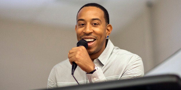 Rapper Ludacris speaks during a visit to the charter school students at Utopian Academy for the Arts, Friday, Sept. 26, 2014, in Riverdale, Ga. Georgia Gov. Nathan Deal and Ludacris may seem like an odd pairing for a campaign event, but the duo was a hit with a cheering crowd of students Friday. Christopher "Ludacris" Bridges has been an outspoken supporter of President Barack Obama, penning a profane song during the 2008 campaign criticizing his opponents. But Deal says he couldn't think of anyone better to inspire students at the event. (AP Photo/David Goldman)