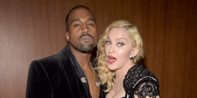 LOS ANGELES, CA - FEBRUARY 08: Recording artist Kanye West (R) and singer Madonna (L) attend The 57th Annual GRAMMY Awards a