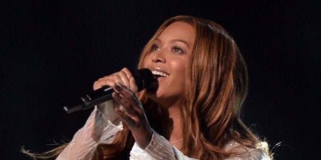 Beyoncé performs on stage at the 57th Annual Grammy Awards in Los Angeles February 8, 2015. AFP PHOTO / ROBYN BECK (Photo credit should read ROBYN BECK/AFP/Getty Images)