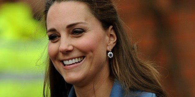 Britain's Kate, Duchess of Cambridge during a visit to Emma Bridgewater factory in Stoke on Trent, England, to see production of a mug,Wednesday Feb. 18 2015. Emma Bridgewater factory has launched a mug to be sold in support of East Anglia's Children's Hospices. (AP Photo/Rui Vieira)