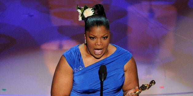 Mo'Nique accepts the Oscar for best performance by an actress in a supporting role for âPrecious: Based on the Novel 'Push'