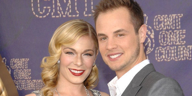 FILE - In this April 14, 2008 file photo,sSinger LeAnn Rimes and her husband Dean Sheremet arrive at the 2008 CMT Awards in Nashville, Tenn. (AP Photo/Evan Agostini, file)