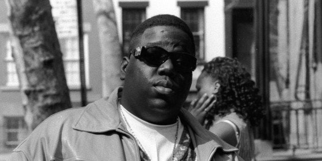 American rapper Biggie Smalls (also known as the Notorious B.I.G., born Christopher Wallace, 1972 - 1997) holds a bottle of St. Ides malt liquor, New York, New York, 1995. (Photo by Adger Cowans/Getty Images)