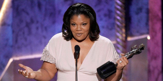 Mo'Nique accepts the award for best female actor in a supporting role for "Precious" at the 16th Annual Screen Actors Guild Awards on Saturday, Jan. 23, 2010, in Los Angeles. (AP Photo/Mark J. Terrill)