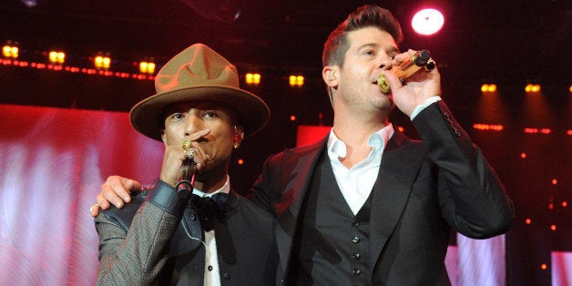 LOS ANGELES, CA - JANUARY 25: Pharrell Williams and Robin Thicke perform onstage during the 56th annual GRAMMY Awards Pre-GRAMMY Gala and Salute to Industry Icons honoring Lucian Grainge at The Beverly Hilton on January 25, 2014 in Los Angeles, California. (Photo by Kevin Mazur/WireImage)