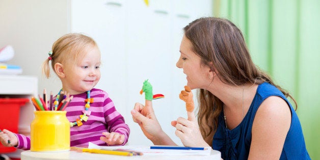 Mother and daughter playing with finger toys