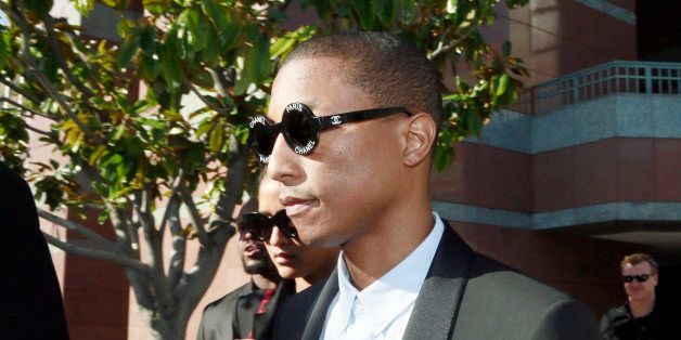 Pharrell Williams leaves Los Angeles Federal Court after testifying at trial in Los Angeles, Wednesday, March 4, 2015. The Grammy-winning singer Williams says he wasn't trying to copy the late Marvin Gaye's music for the hit song "Blurred Lines," but he was trying to evoke the feeling of late 1970s tunes. Williams is being sued by Gaye's children, who claim "Blurred Lines" improperly copies their father's hit "Got to Give it Up." Singer Robin Thicke and rapper T.I. are also defendants in the case. (AP Photo/Nick Ut)