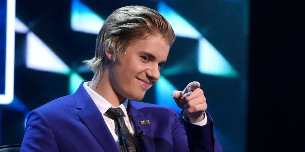 Justin Bieber gestures on stage at the Comedy Central Roast of Justin Bieber at Sony Pictures Studios on Saturday, March 14, 2015, in Culver City, Calif. (Photo by Chris Pizzello/Invision/AP)