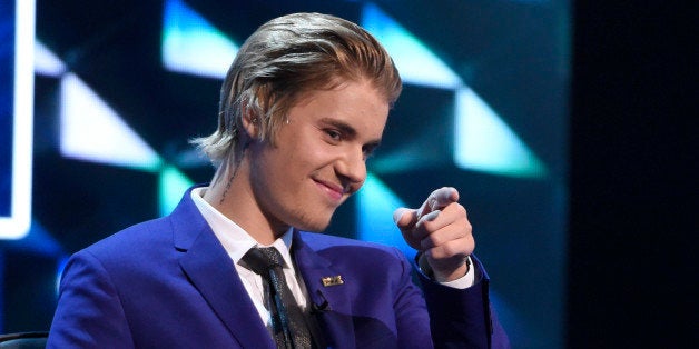 Justin Bieber gestures on stage at the Comedy Central Roast of Justin Bieber at Sony Pictures Studios on Saturday, March 14,