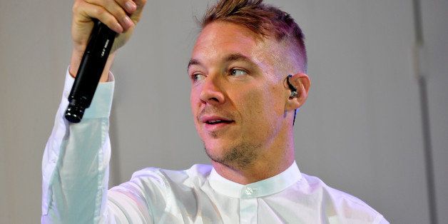 PARIS, FRANCE - MARCH 03: DJ Diplo performs on the runway during the ETAM show as part of the Paris Fashion Week Womenswear Fall/Winter 2015/2016 at Piscine Molitor on March 3, 2015 in Paris, France. (Photo by Kristy Sparow/Getty Images for ETAM)