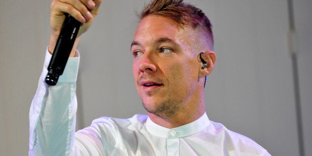 PARIS, FRANCE - MARCH 03: DJ Diplo performs on the runway during the ETAM show as part of the Paris Fashion Week Womenswear Fall/Winter 2015/2016 at Piscine Molitor on March 3, 2015 in Paris, France. (Photo by Kristy Sparow/Getty Images for ETAM)