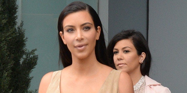 NEW YORK, NY - JUNE 26: Kim Kardashian and Kourtney Kardashian are seen is seen in Soho on June 26, 2014 in New York City. (Photo by Raymond Hall/GC Images)