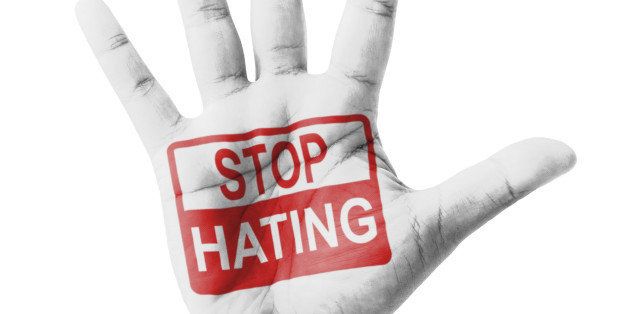 Open hand raised, Stop Hating sign painted, multi purpose concept - isolated on white background