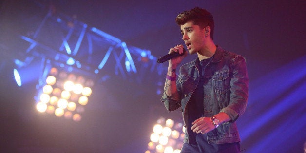LONDON, ENGLAND - OCTOBER 07: Zayn Malik of One Direction performs at the Radio One Teen Awards at Wembley Arena on October