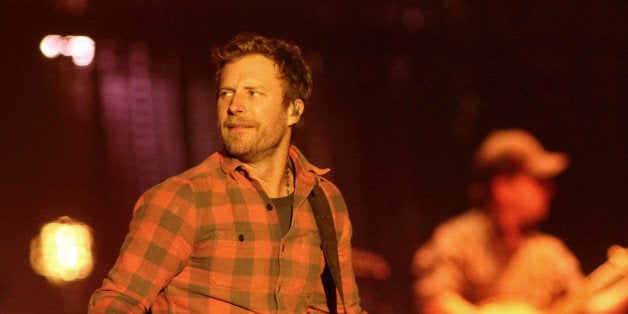 Singer-songwriter Dierks Bentley performs in concert during his âRiser Tour 2014â at the Royal Farms Arena on Saturday, Nov. 22, 2014, in Baltimore. (Photo by Owen Sweeney/Invision/AP)