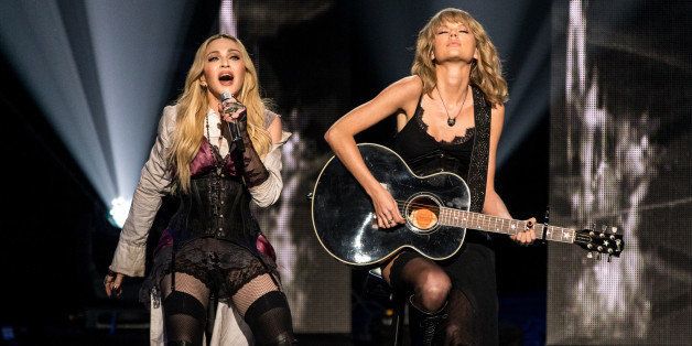 LOS ANGELES, CA - MARCH 29: iHEARTRADIO MUSIC AWARDS -- Pictured: (l-r) Recording artists Madonna and Taylor Swift perform onstage at the iHeartRadio Music Awards held at the Shrine Auditorium on March 29, 2015 in Los Angeles, California. -- (Photo by Christopher Polk/NBC/NBC via Getty Images)