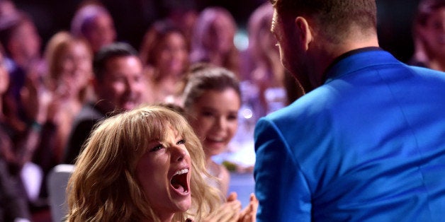 LOS ANGELES, CA - MARCH 29: Singer/songwriter Taylor Swift (L) reacts to winning the Best Lyrics award for 'Blank Space' with singer Justin Timberlake in the audience during the 2015 iHeartRadio Music Awards which broadcasted live on NBC from The Shrine Auditorium on March 29, 2015 in Los Angeles, California. (Photo by Kevin Winter/Getty Images for iHeartMedia)