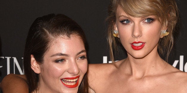 BEVERLY HILLS, CA - JANUARY 11: Recording artist Lorde and recording artist Taylor Swift attend the 2015 InStyle And Warner
