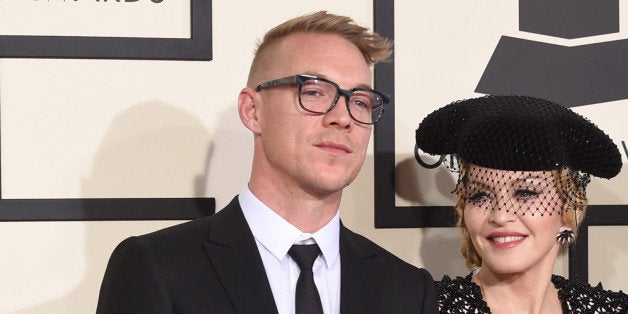 LOS ANGELES, CA - FEBRUARY 08: (L-R) Producer Diplo, singer Madonna, and rapper Nas attend The 57th Annual GRAMMY Awards at the STAPLES Center on February 8, 2015 in Los Angeles, California. (Photo by Jason Merritt/Getty Images)