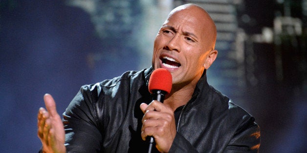 LOS ANGELES, CA - APRIL 12: Actor Dwayne Johnson speaks onstage during The 2015 MTV Movie Awards at Nokia Theatre L.A. Live on April 12, 2015 in Los Angeles, California. (Photo by Jeff Kravitz/MTV1415/FilmMagic)