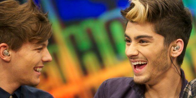 MADRID, SPAIN - OCTOBER 31: Louis Tomlinson and Zayn Malik (R) of One Direction attend 'El Hormiguero' Tv show at Vertice Studio on October 31, 2012 in Madrid, Spain. (Photo by Juan Naharro Gimenez/Getty Images)