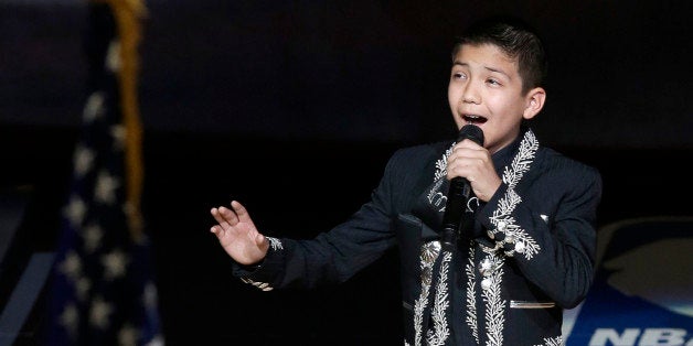 Sebastien De la Cruz sings the national anthem before Game 4 of the NBA Finals basketball series between the San Antonio Spurs and the Miami Heat, Thursday, June 13, 2013, in San Antonio. (AP Photo/David J. Phillip)