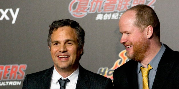 Actor Mark Ruffalo, left, and director Joss Whedon, right, pose for photos at a red carpet event for their latest film, Marvel's "Avengers: Age Of Ultron" in Beijing, Sunday, April 19, 2015. The movie will open in China on Tuesday, May 12. (AP Photo/Mark Schiefelbein)