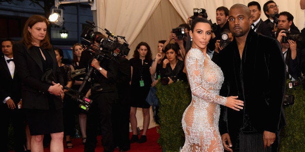 NEW YORK, NY - MAY 04: Kim Kardashian West (L) and Kanye West attend the 'China: Through The Looking Glass' Costume Institute Benefit Gala at the Metropolitan Museum of Art on May 4, 2015 in New York City. (Photo by Dimitrios Kambouris/Getty Images)