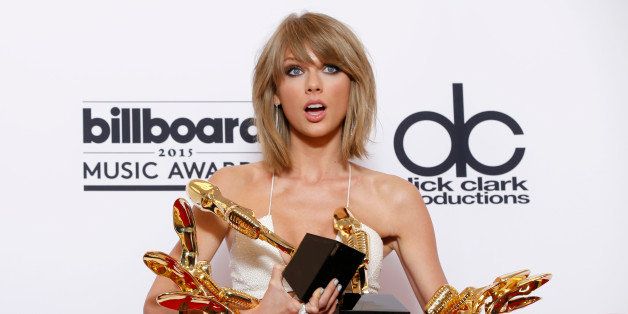 Taylor Swift poses in the press room with the awards for top Billboard 200 album for â1989," top female artist, chart achievement, top artist, top Billboard 200 artist, top hot 100 artist, top digital song artist, and top streaming song (video) for âShake It Offâ at the Billboard Music Awards at the MGM Grand Garden Arena on Sunday, May 17, 2015, in Las Vegas. (Photo by Eric Jamison/Invision/AP)