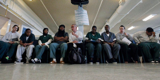 In this photo taken Aug. 2, 2011, former New Jersey Gov. James McGreevey, center, speaks to a gathering of women inmates at Integrity House, a transitional housing/residential treatment area for women incarcerated at the Hudson County Correctional Center, in Kearney, N.J. Seven years after coming out as the nation's first openly gay governor and resigning over an affair with a male staffer, McGreevey 54, is the spiritual counselor to 40 women inmates at the North Jersey facility, who have been locked up for crimes ranging from manslaughter and gun possession to drug dealing. (AP Photo/Mel Evans)