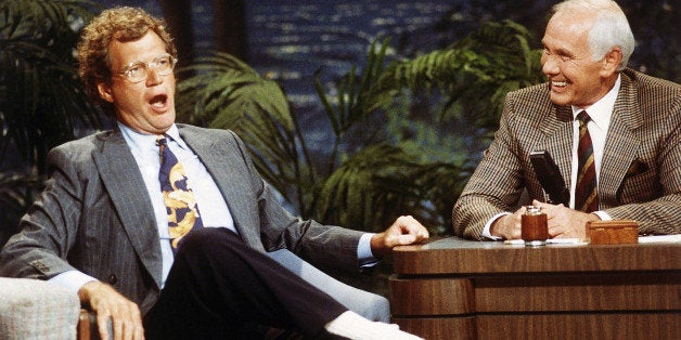 FILE - In this Aug. 30, 1991 file photo, "Late Night with David Letterman" host David Letterman, left, appears with host Johnny Carson during taping of "The Tonight Show," at the NBC Studio in Burbank, Calif. After 33 years in late night and 22 years hosting CBS' "Late Show," Letterman will retire on May 20. (AP Photo/Bob Galbraith, File)